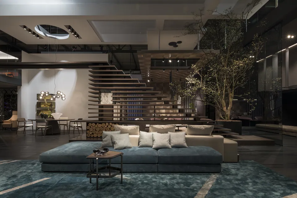 Giorgetti Skyline fabric sofa with integrated magazine rack, photographed for the catalogue